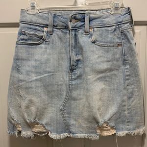 Distressed denim mini skirt
